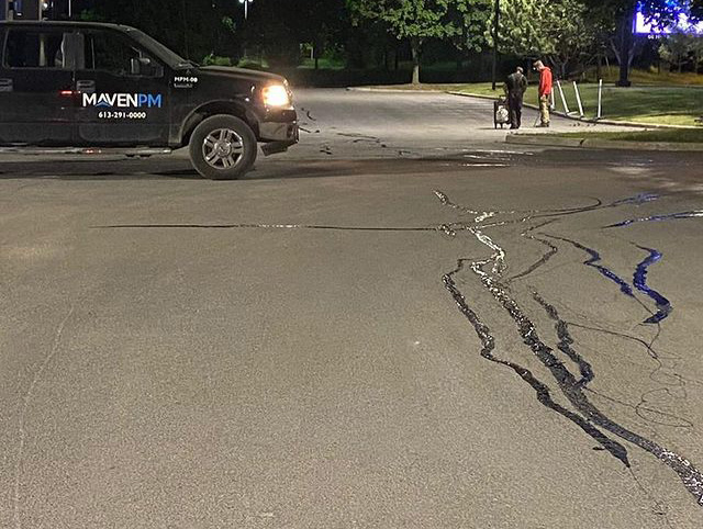asphalt cracks repaired in a parking lot