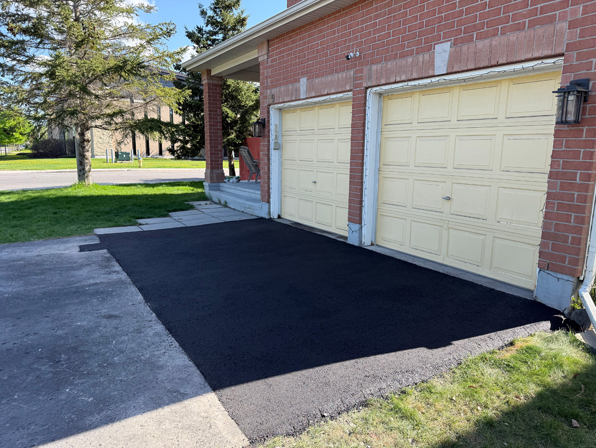 asphalt cut out and replaced infront of garage doors on a driveway