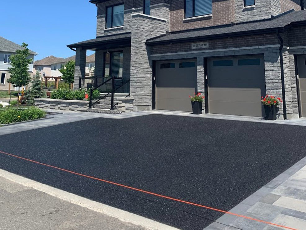 large residential driveway after the asphalt was sealed